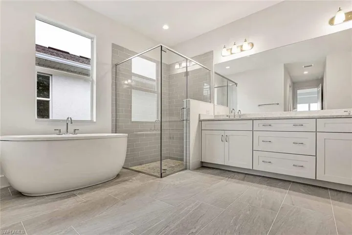 Primary bathroom with soaking tub and luxe walk-in shower