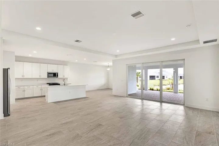 Beautiful open-cocept layout with kitchen, great room, and casual dining space pictured