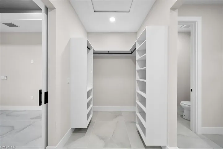 Walk in closet featuring light tile patterned floors