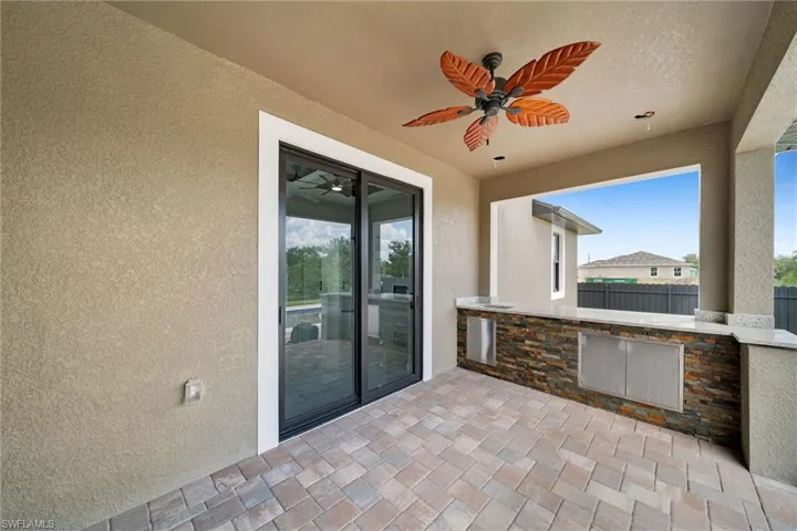 View of patio featuring ceiling fan