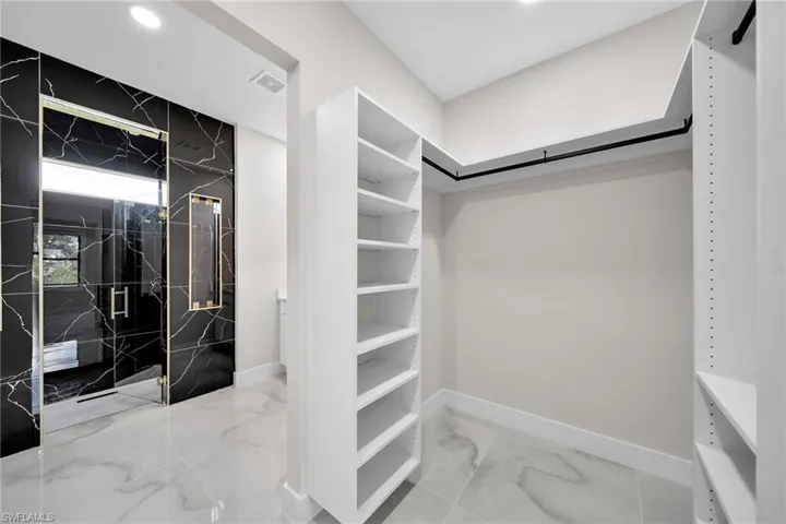 Spacious closet with tile patterned flooring