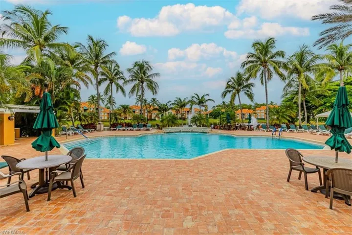 Community pool with a patio