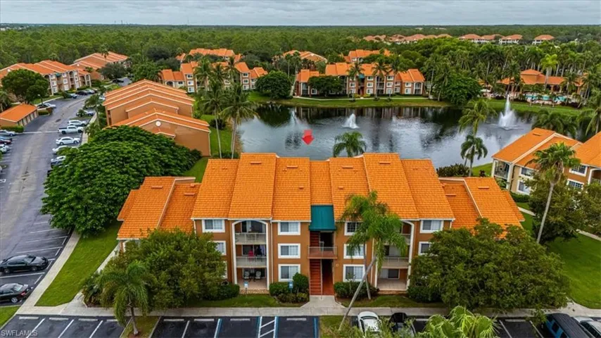 Bird's eye view of apartment complex and a large body of water