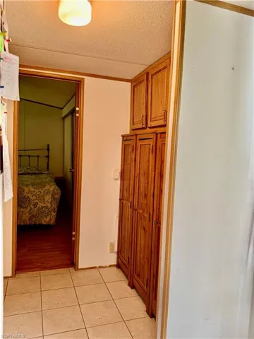 Corridor with pantry/storage.