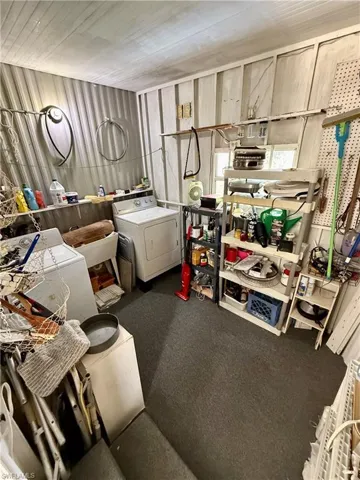 Utility/workroom space with separate washer and dryer