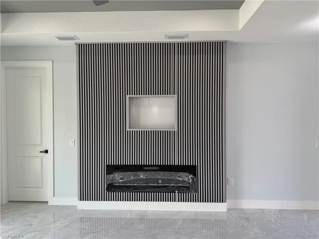 Detailed view of an accent wall and baseboards