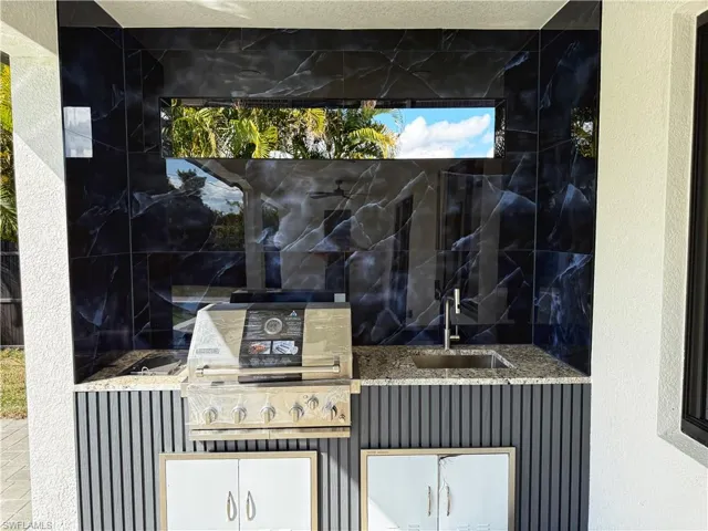View of patio / terrace with a sink and exterior kitchen