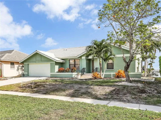 Ranch-style home featuring a garage