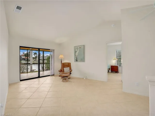 Sitting room featuring ceiling fan and light tile patterned floors