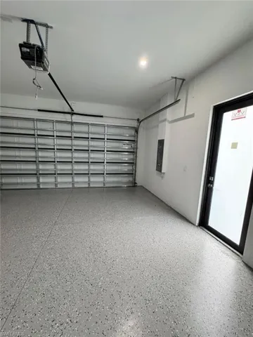 Garage featuring a garage door opener