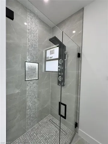 Full bath featuring a stall shower