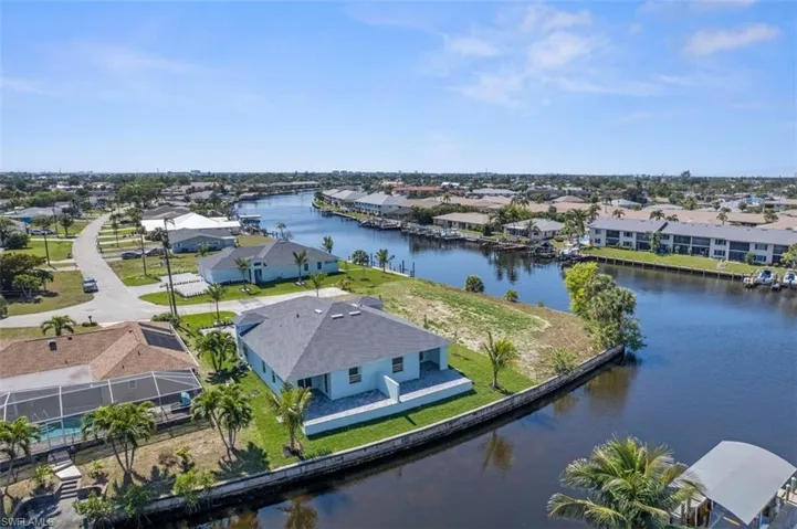 Birds eye view of property featuring a residential view and a water view