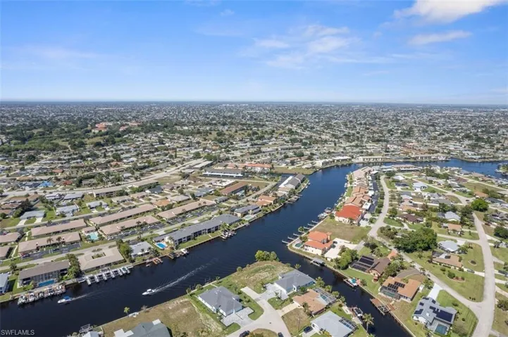 Birds eye view of property featuring a residential view and a water view