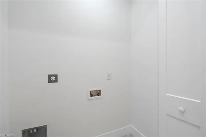 Laundry area featuring hookup for a washing machine, baseboards, laundry area, and hookup for an electric dryer