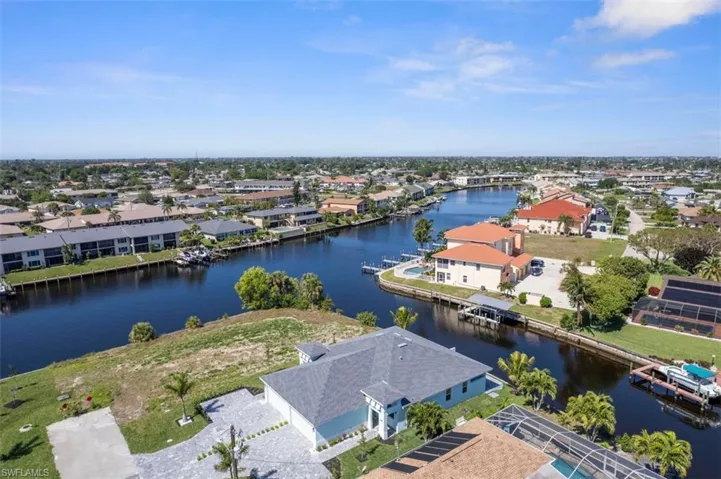 Birds eye view of property featuring a residential view and a water view