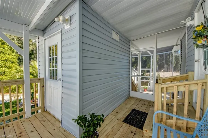 Sunroom featuring plenty of natural light and a deck