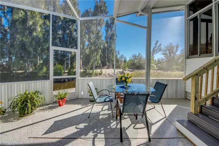 Sunroom / solarium with outdoor dining area