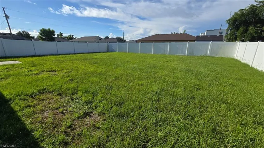 View of fenced backyard