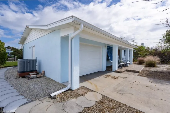 View of side of property featuring a garage