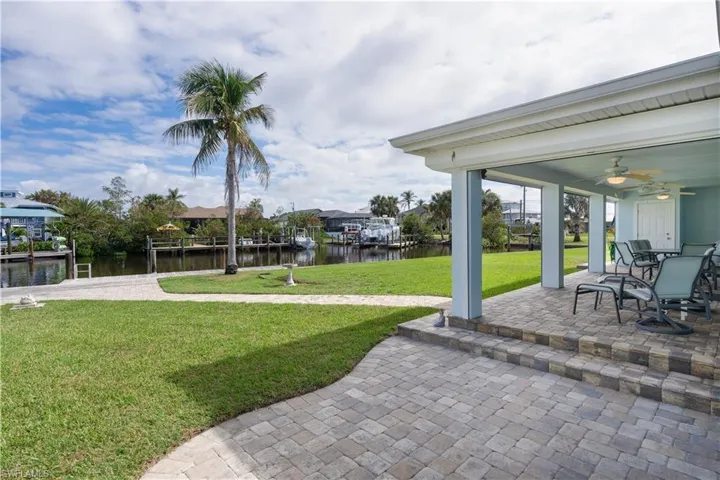 View of patio / terrace featuring ceiling fan and a water view