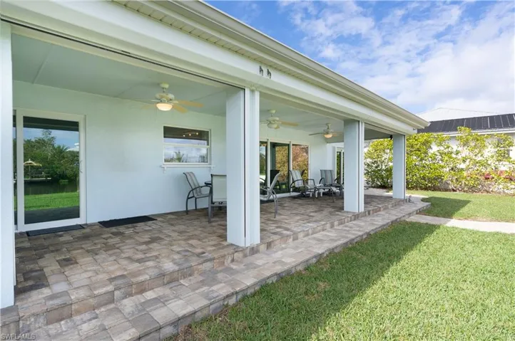 View of patio featuring ceiling fan