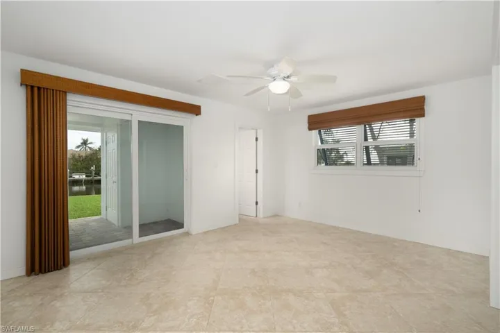Master Bedroom with a wealth of natural light and ceiling fan