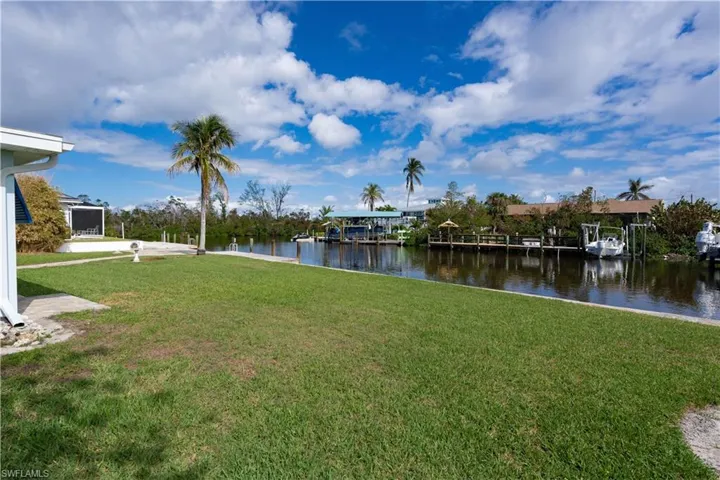 View of yard with a water view