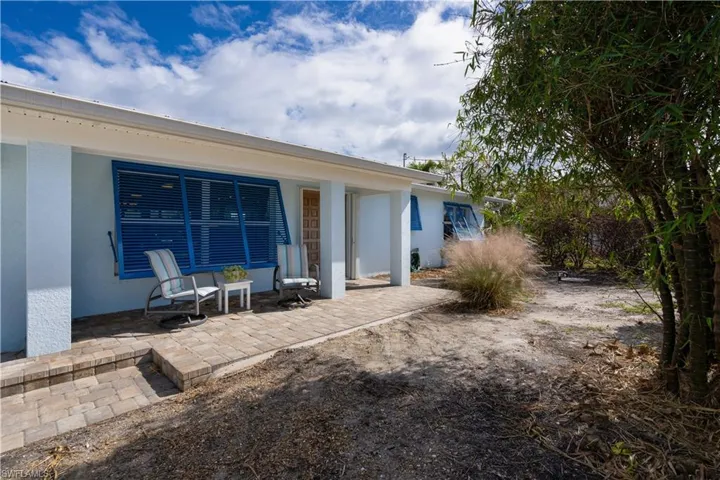 Back of house with a patio area
