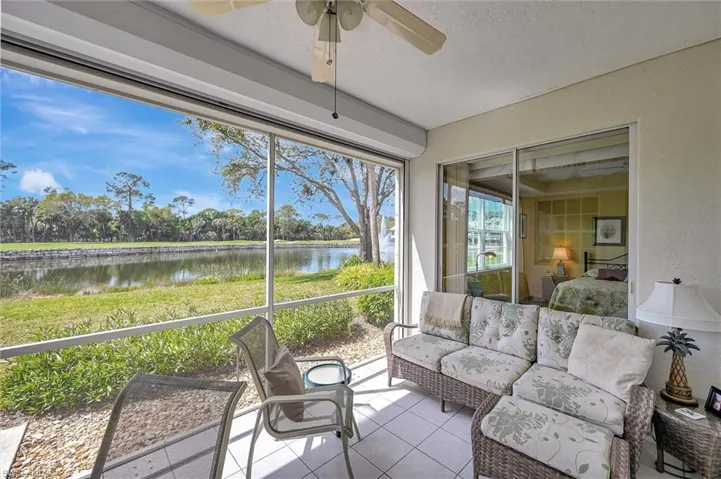 Screened Lanai with Power Hurricane shutters and a lovely golf and water view. Water feature to the right.