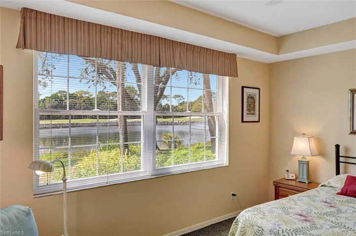 Bedroom featuring a water and golf view!