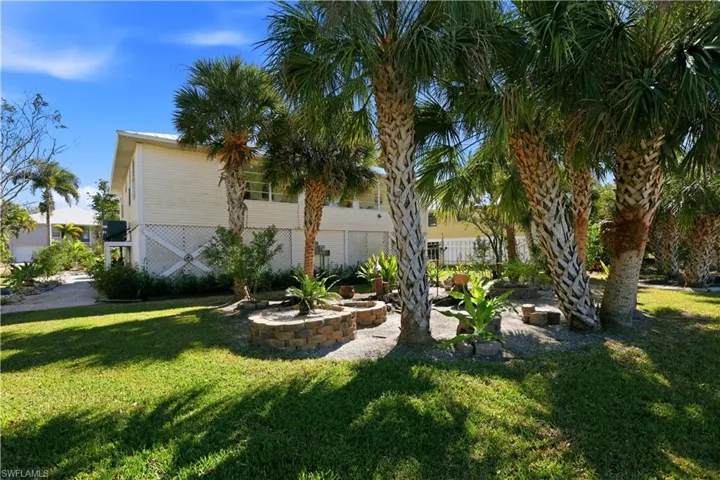 View of grassy yard with a patio