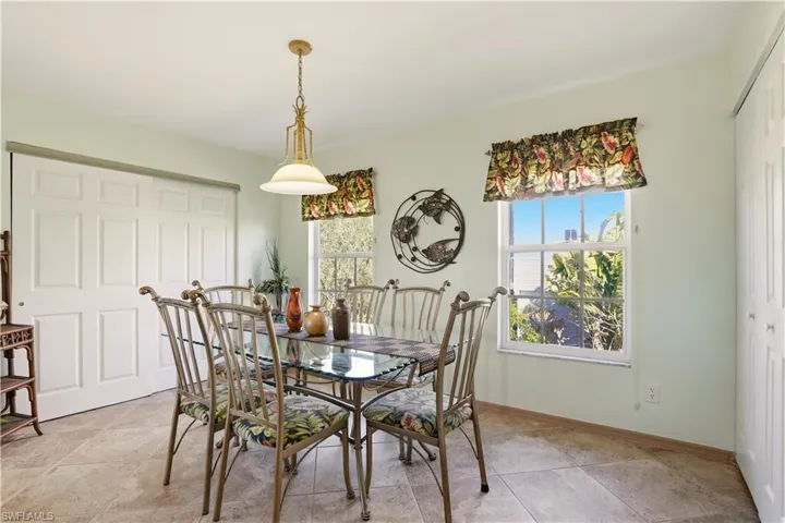 Dining area with large closet for storage and access to the back sunroom