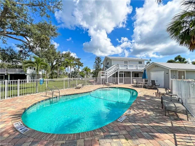 Community pool with a patio
