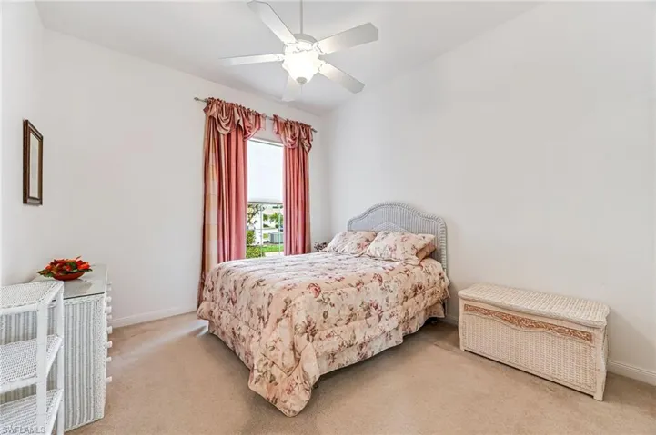 Bedroom featuring carpet and ceiling fan