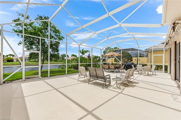 Unfurnished sunroom featuring a water view