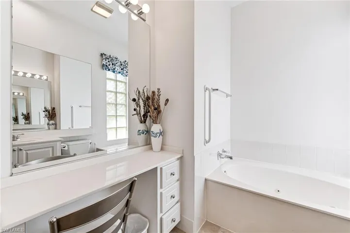 Bathroom with a bath to relax in and oversized vanity