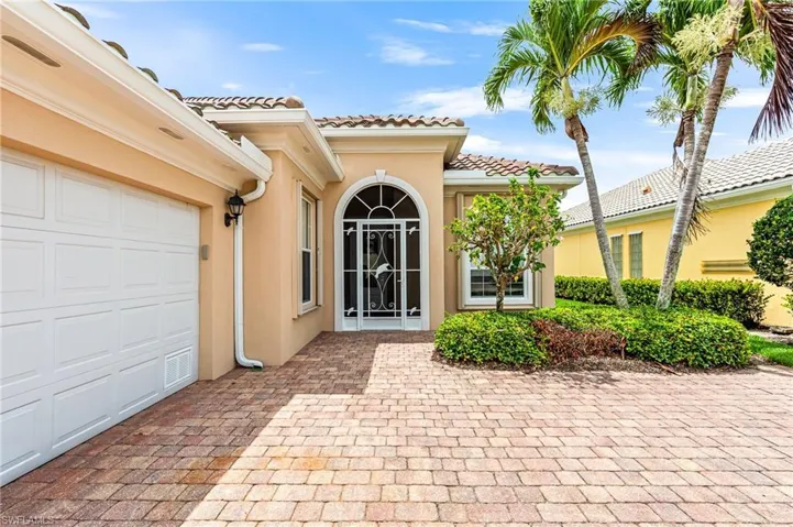 Doorway to property featuring a garage