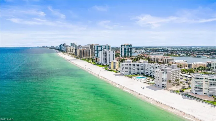 View of urban area with waterfront with a beach