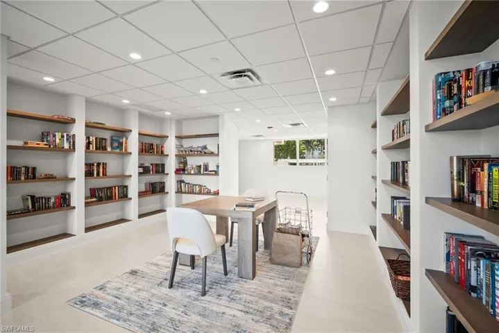Tiled dining area featuring built in features and recessed lighting