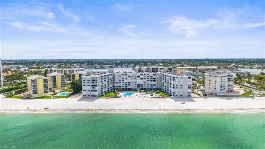 Drone / aerial view of waterfront with a beach