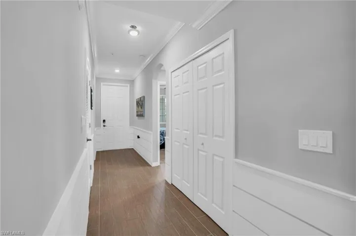 Hallway featuring crown molding
