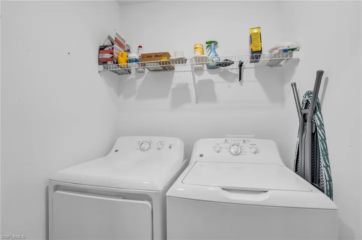 Washroom featuring washing machine and clothes dryer