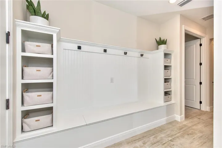 Mudroom featuring wood finished floors and recessed lighting