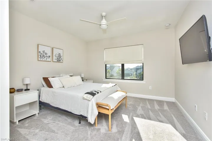 Bedroom featuring carpet floors and ceiling fan