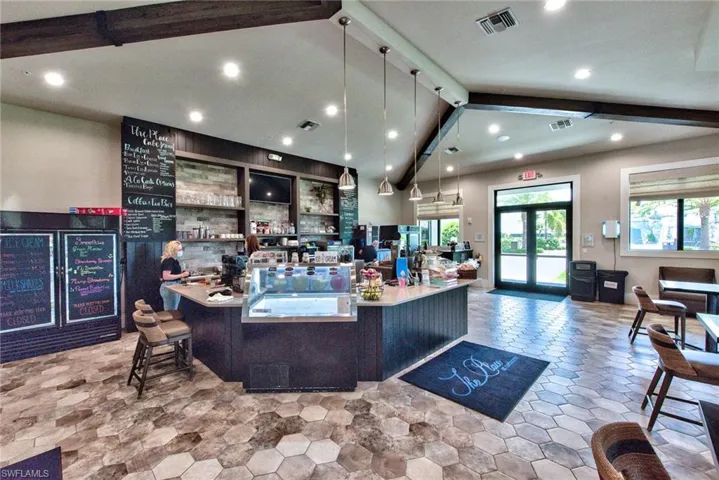 Reception with recessed lighting and a community bar