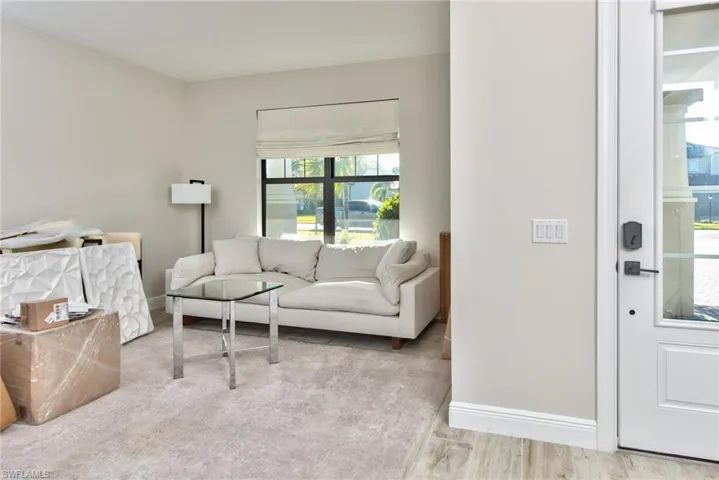 Living room with baseboards and wood finished floors