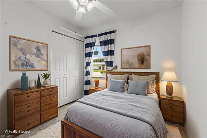 Bedroom featuring a closet and a ceiling fan