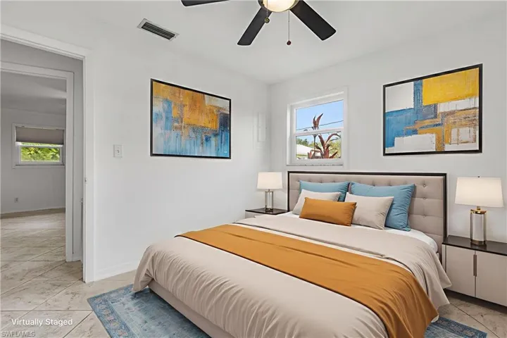 Bedroom with baseboards and ceiling fan
