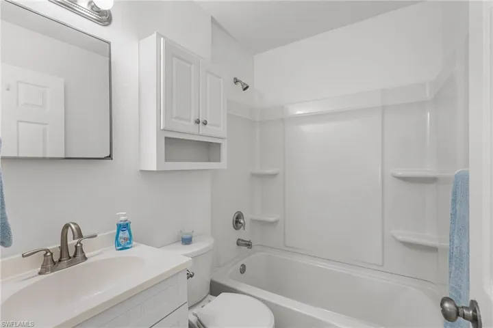 Bathroom featuring vanity and bathtub / shower combination