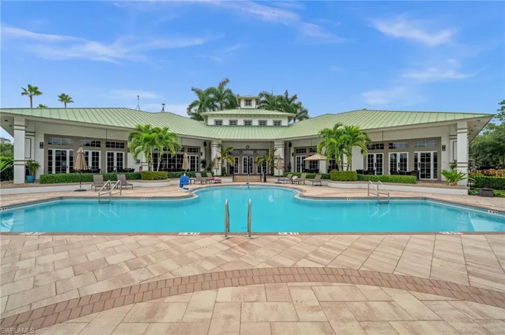 Community pool featuring french doors and a patio